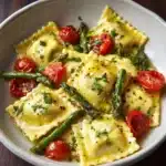 Ravioli with Tomatoes, Asparagus, Garlic, and Herbs Recipe