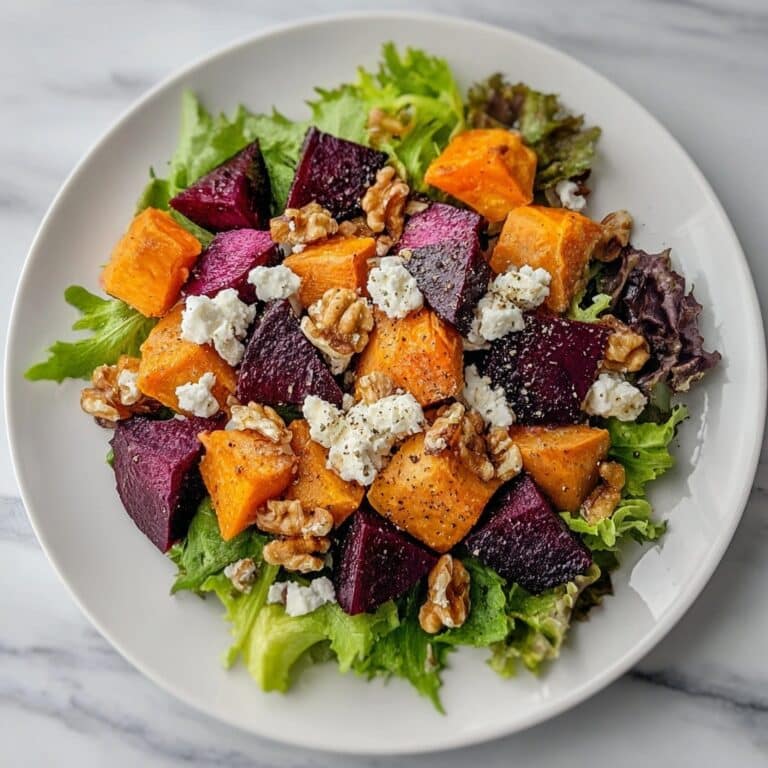 Creamy Roasted Beet Salad with Sweet Potato, Feta, and Walnuts Recipe