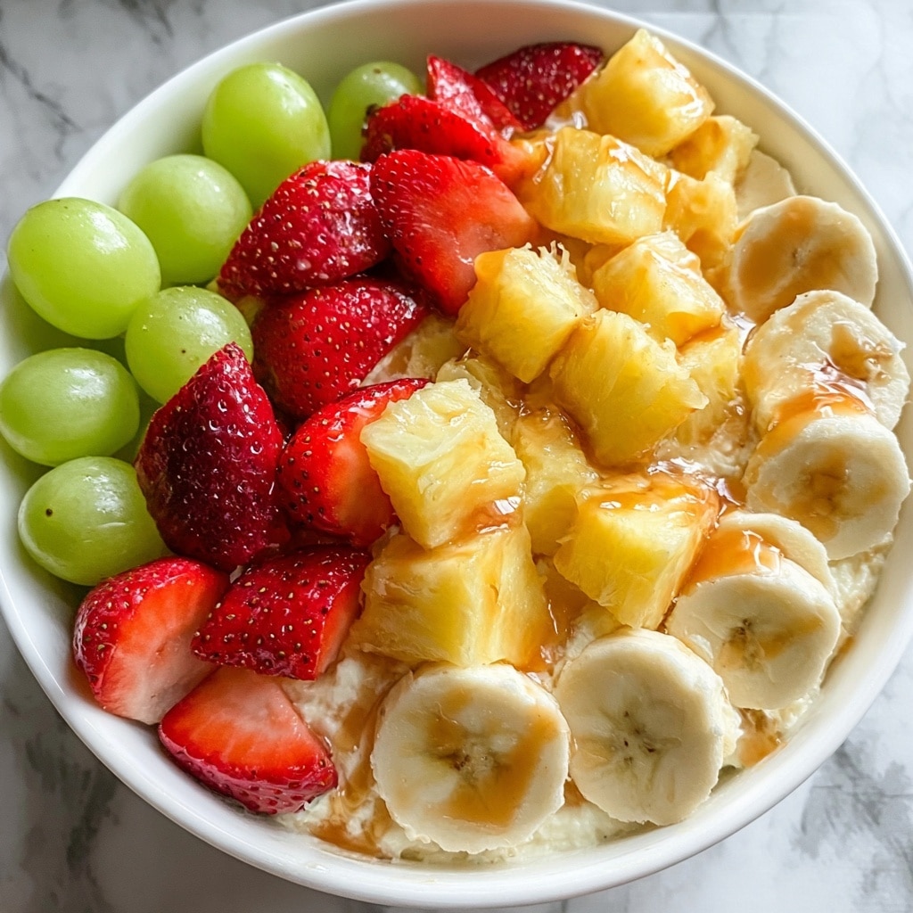 Cheesecake Fruit Salad with Cream Cheese and Caramel Drizzle Recipe - Recipe Image